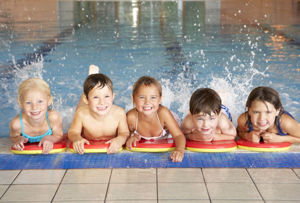 kids splashing and having fun in the pool